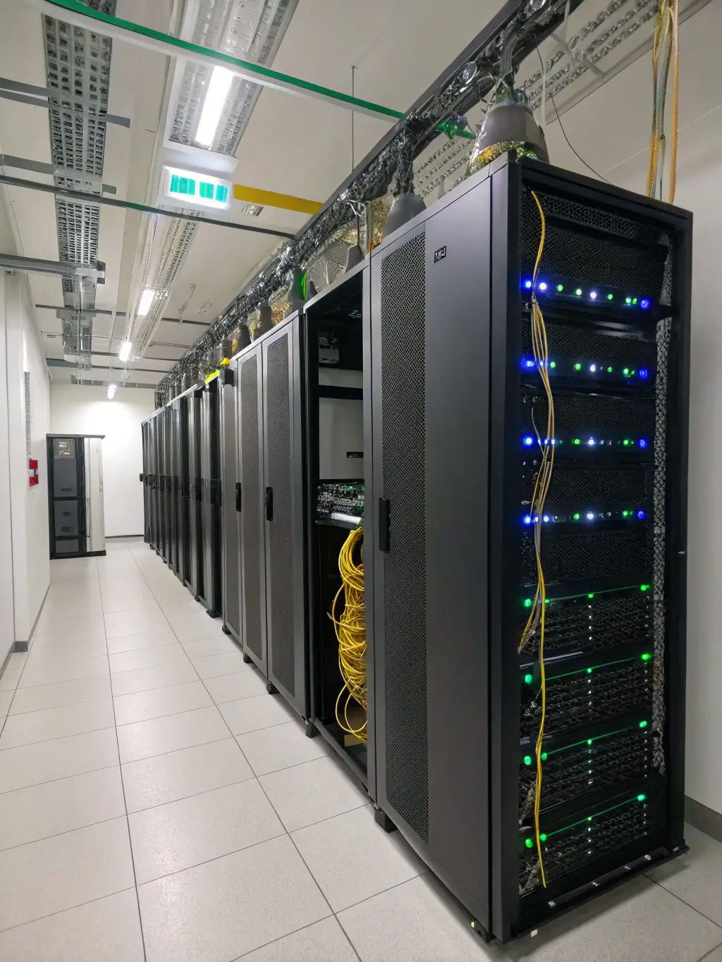 A wide shot of a clean and well-organized server room, showcasing the aesthetic and functional benefits of professional rack integration.